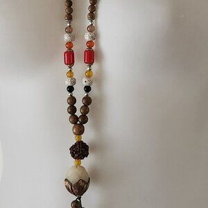 Beautiful long natural tone beaded necklace brown red yellow white blue EUC